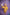 Person in a yellow robe holding a bottle against a purple grid background TR